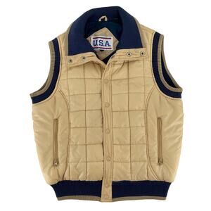 tan puffer vest with navy trim